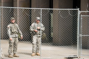 Soldiers guard a bank.
